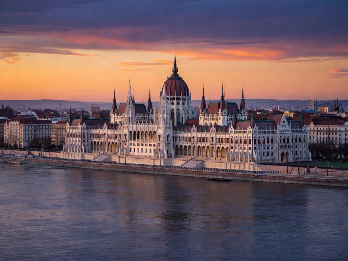 Budapest Hungarian Parliament over the Danube river at dusk